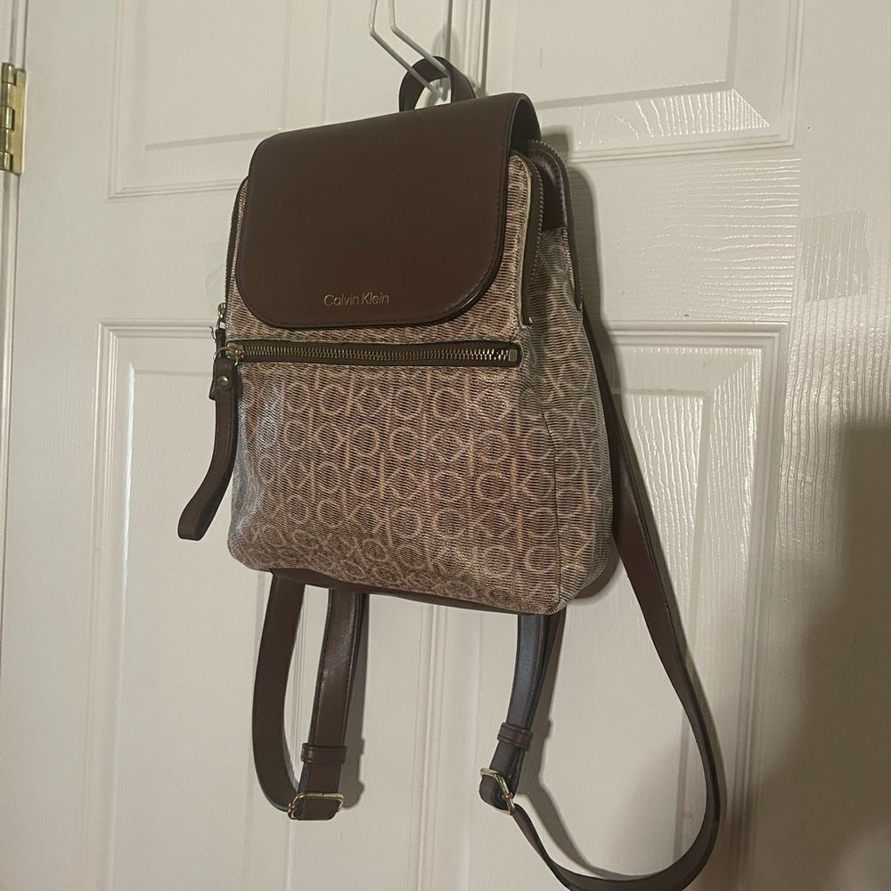 Calvin Klein Tan and Brown Logos small Backpack logo tone hardwares.